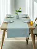 vitamin_vv_89862_A_wooden_table_with_a_tablecloth_in_the_inte_27390af2-fa07-44d7-81d1-64af7797c6d9_3